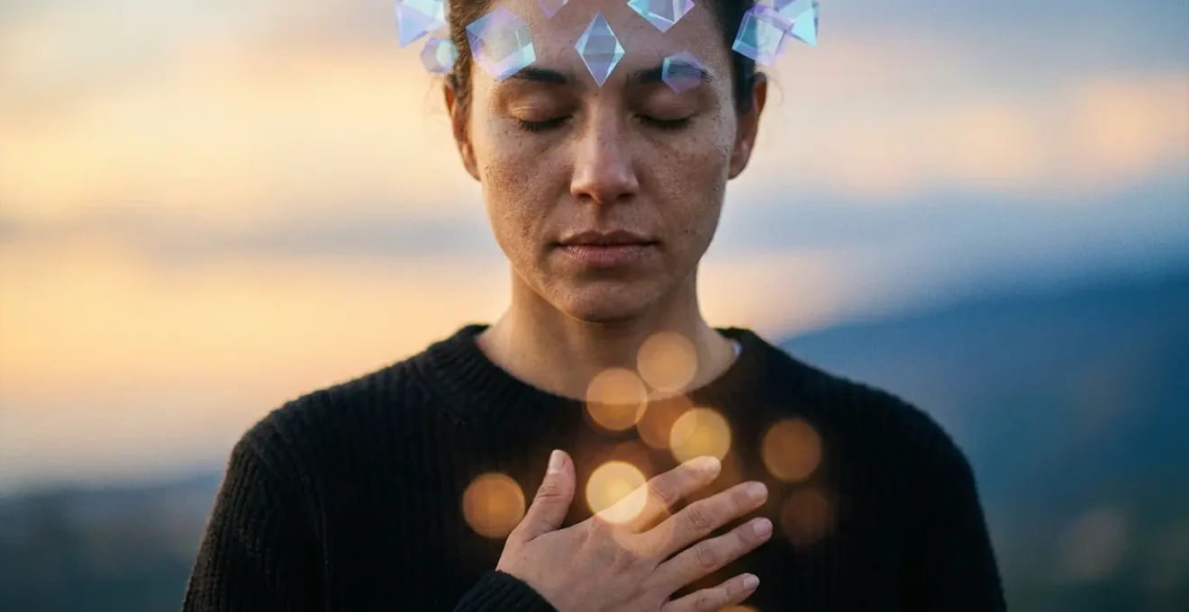 Person reaching across a gap between heart and mind symbolized by floating geometric shapes